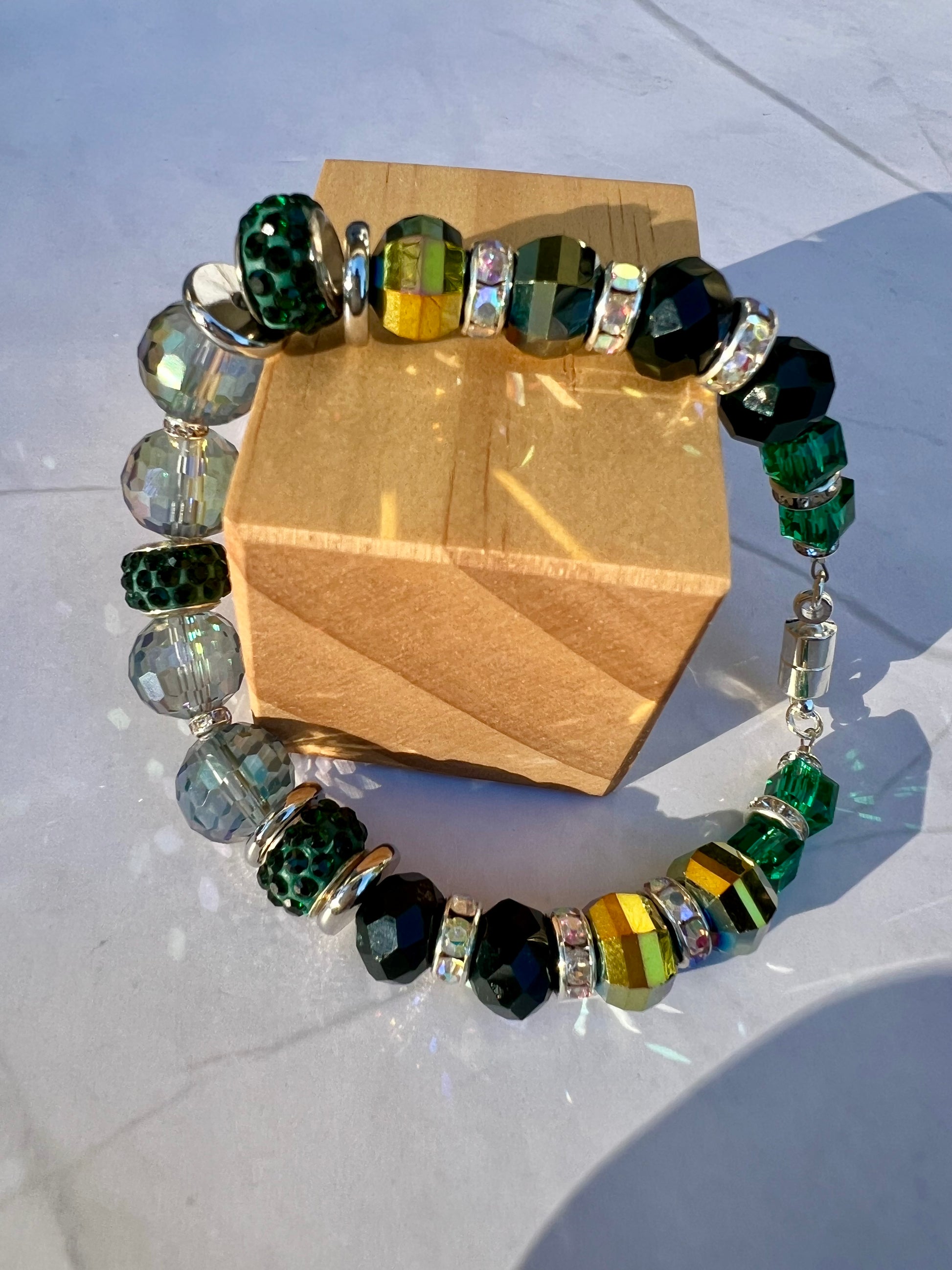 a bracelet made of glass beads on a table