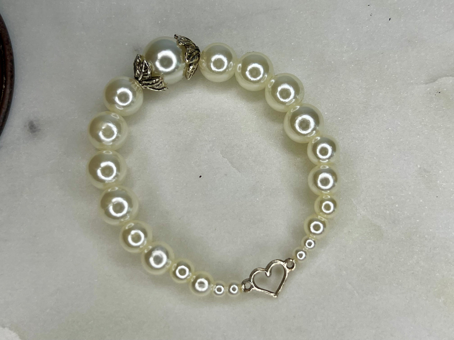 a close up of a bracelet on a table