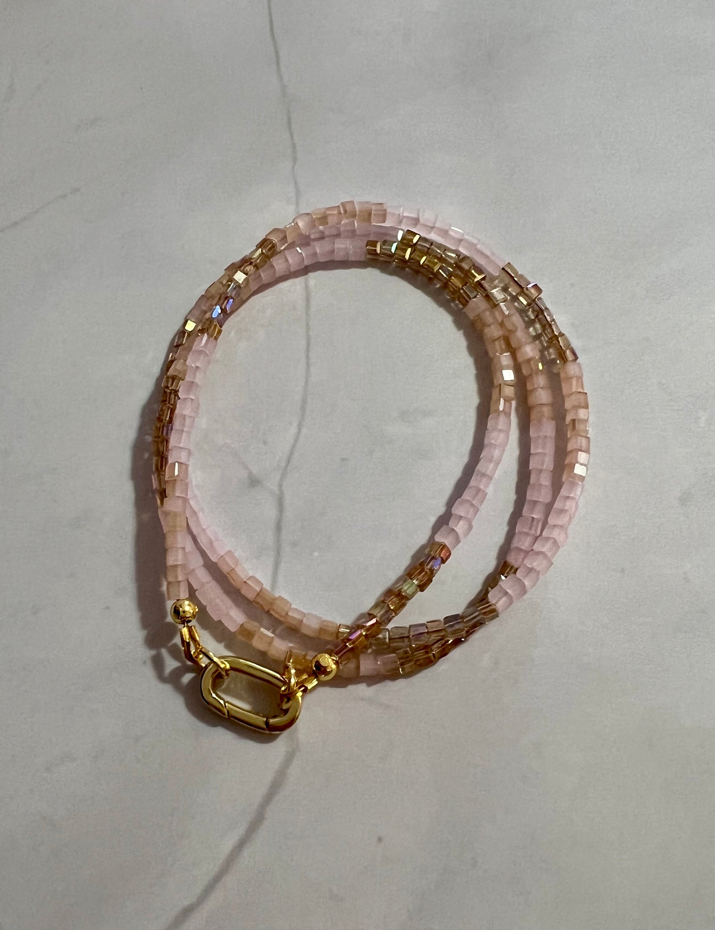 a close up of two bracelets on a table