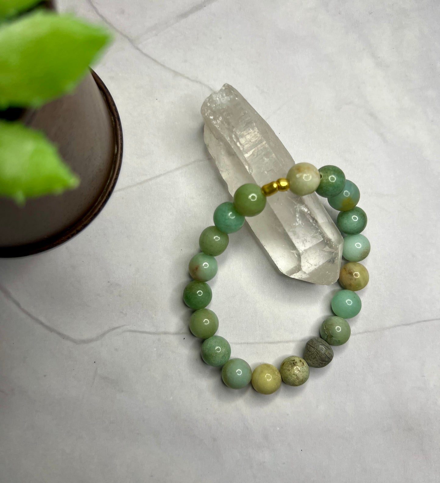 a close up of a bracelet on a table