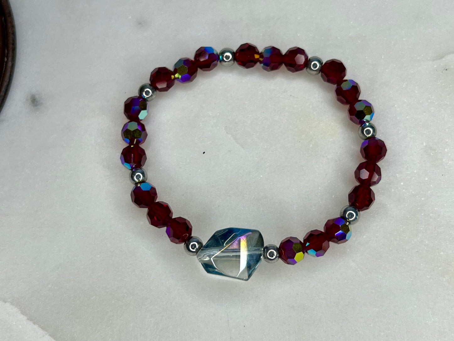 a beaded bracelet with a heart charm