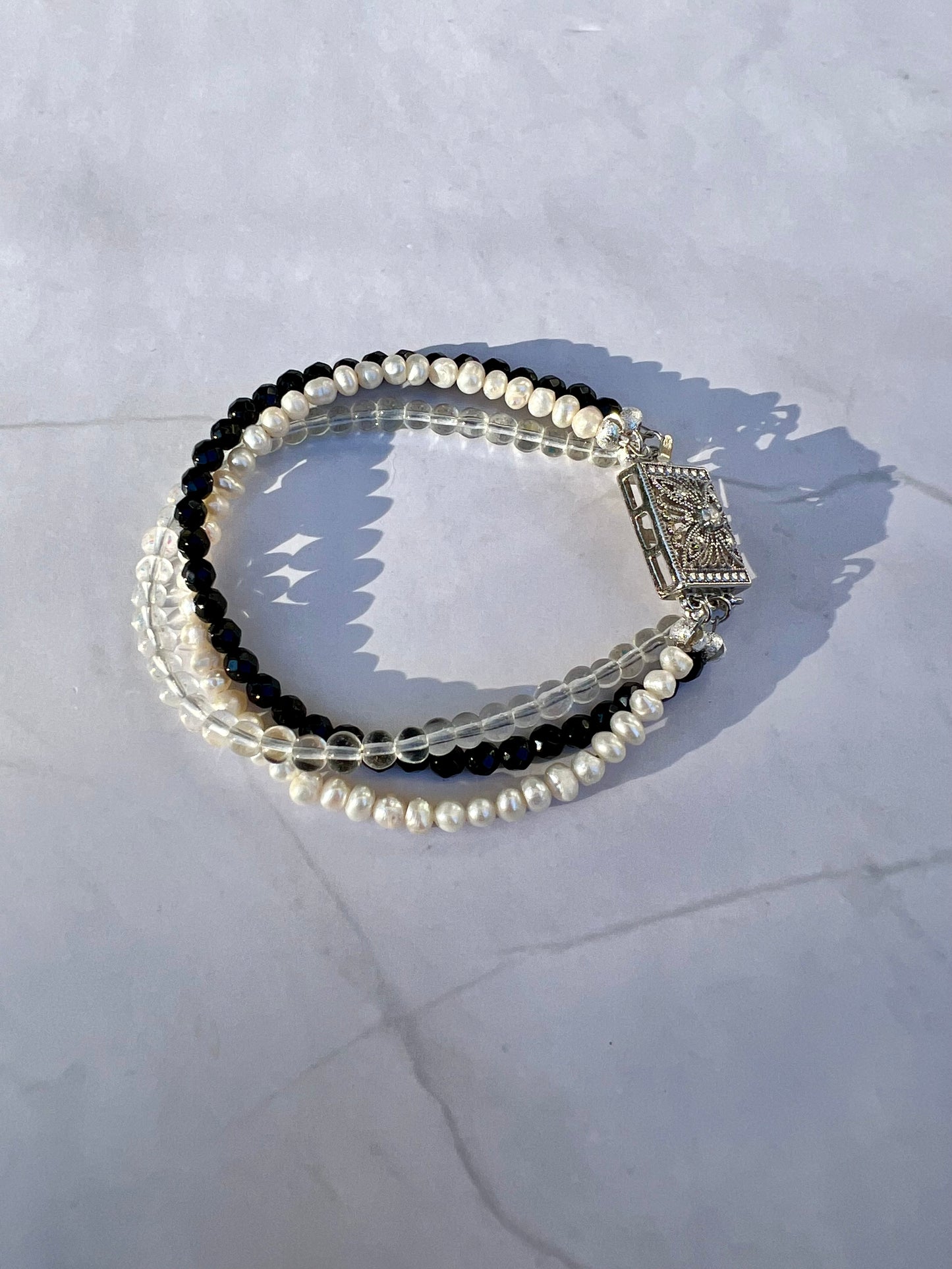 a couple of bracelets sitting on top of a table