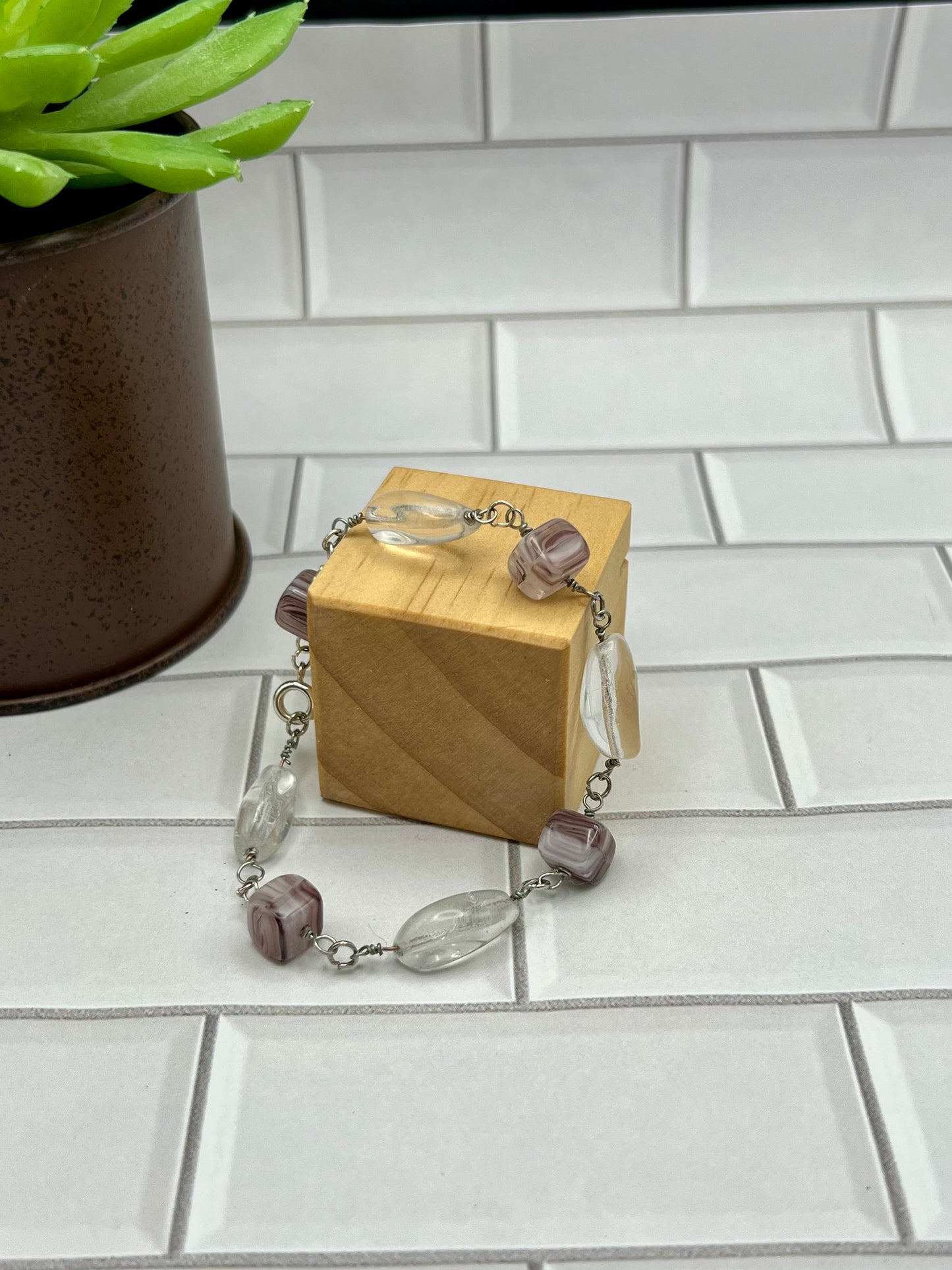 a small wooden box with a chain around it