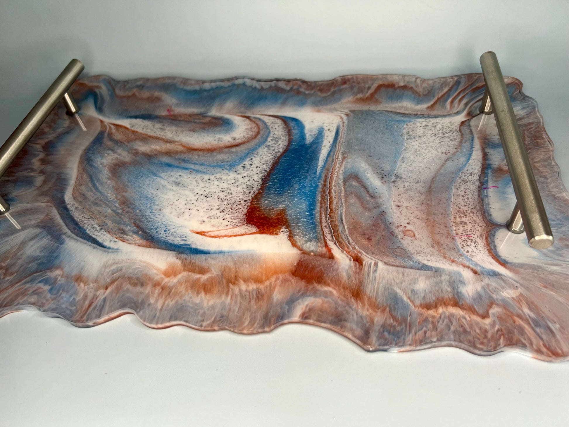 a picture of a marbled surface with metal bars