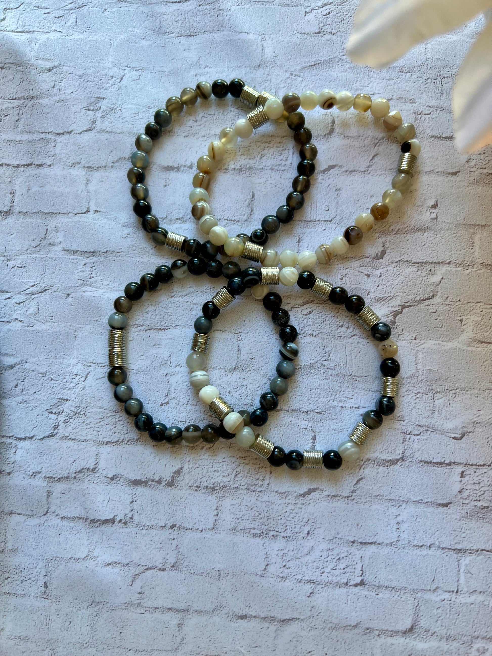 a group of three bracelets sitting on top of a table