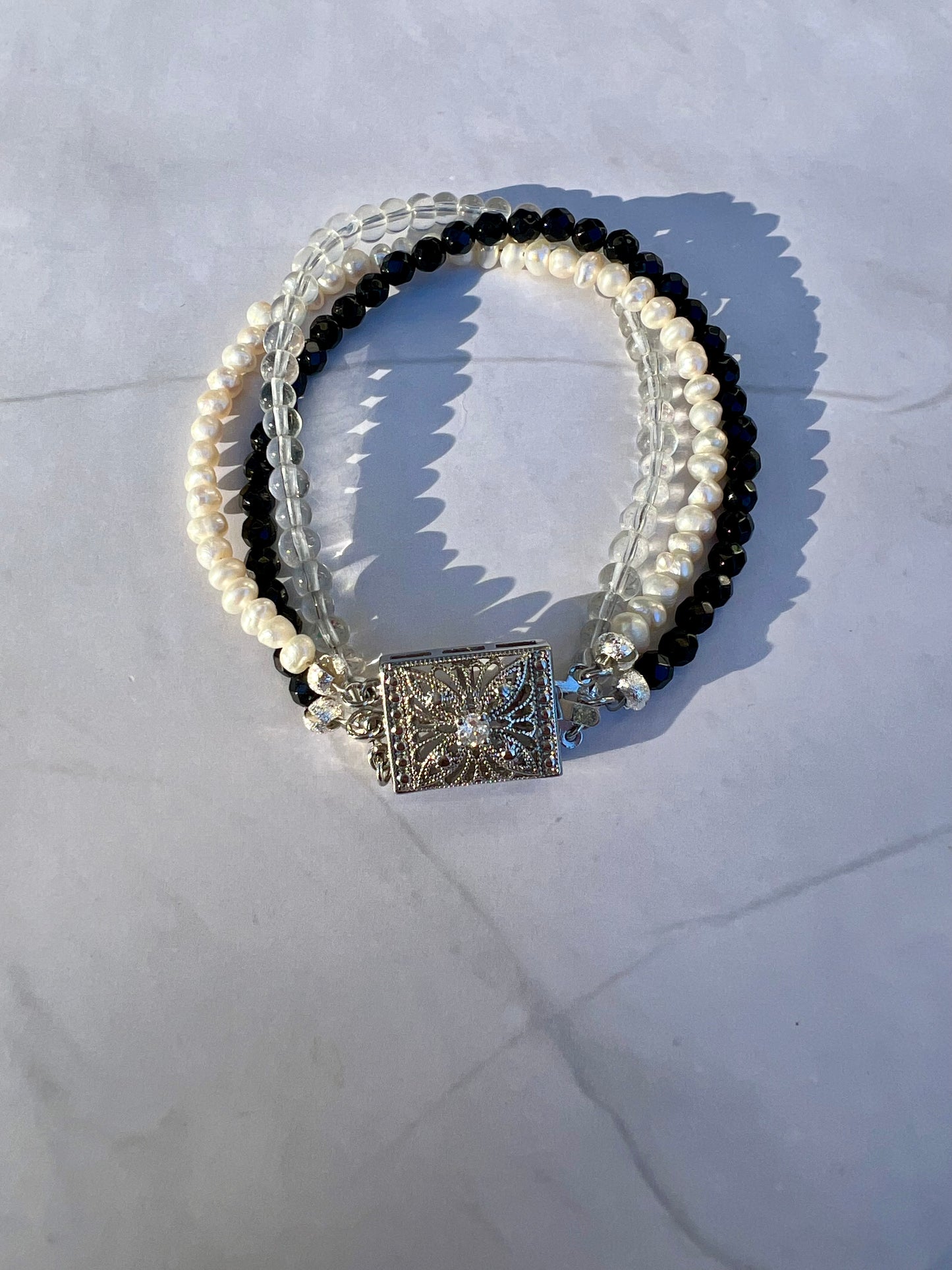 a close up of a bracelet on a table