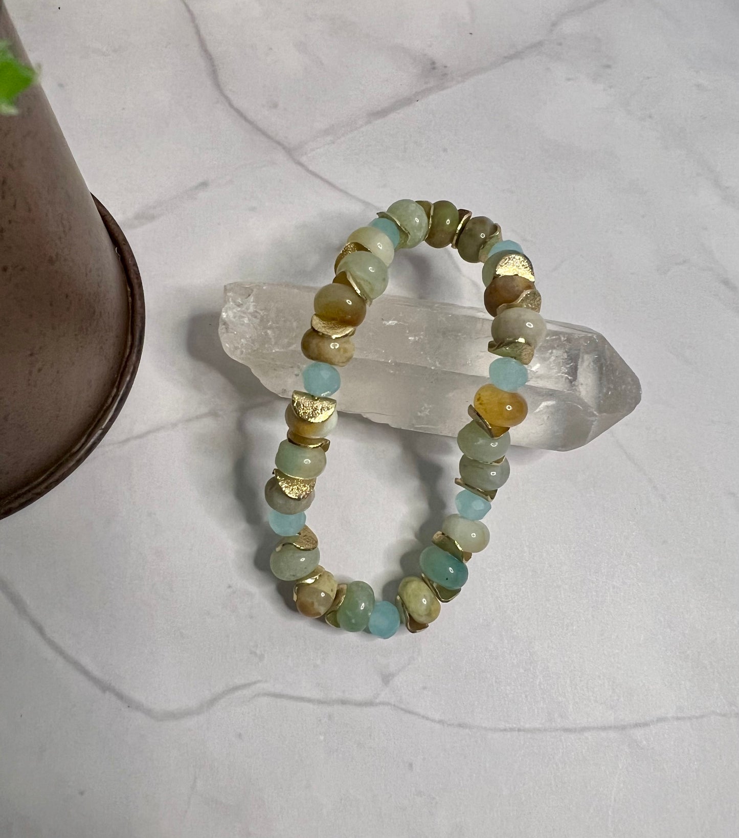 a bracelet made of glass beads on a table