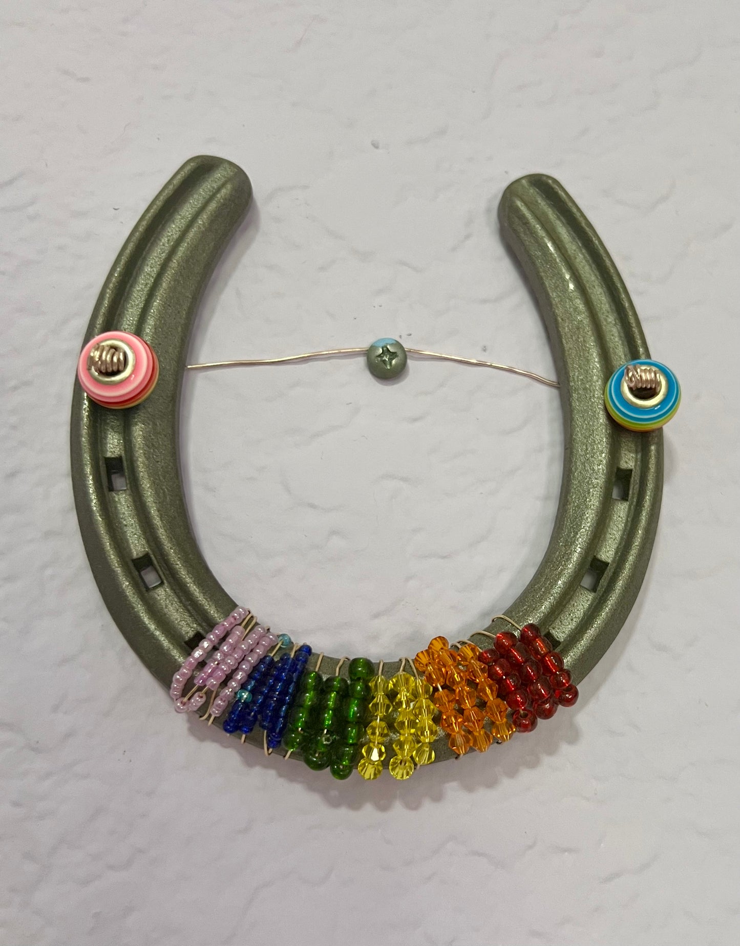 a necklace made out of horseshoes and beads