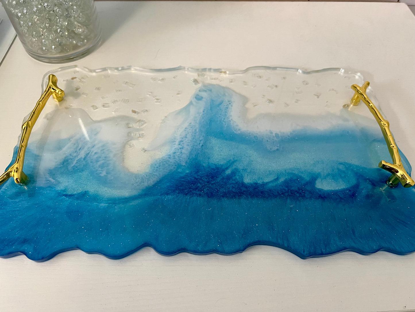 a blue and white glass tray sitting on top of a table