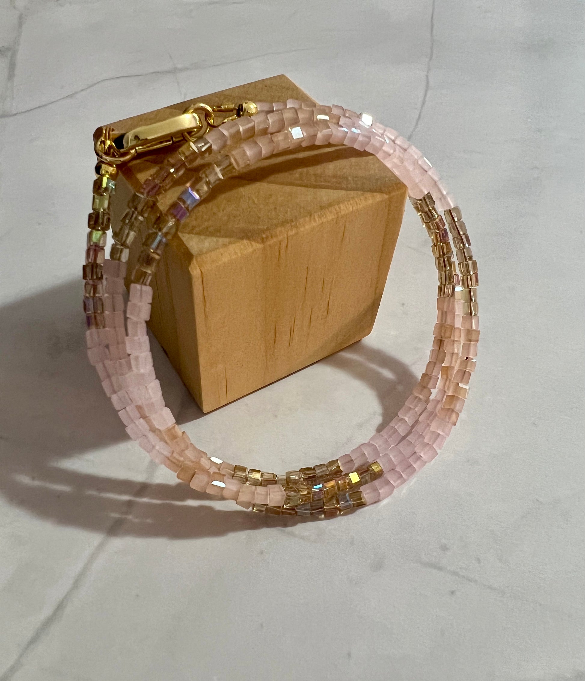 a bracelet with a wooden box on it