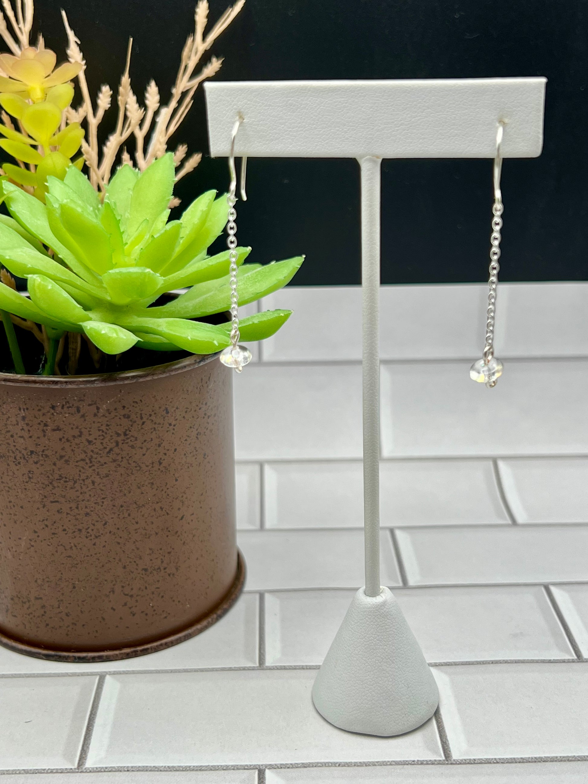 a potted plant sitting on top of a white tile floor